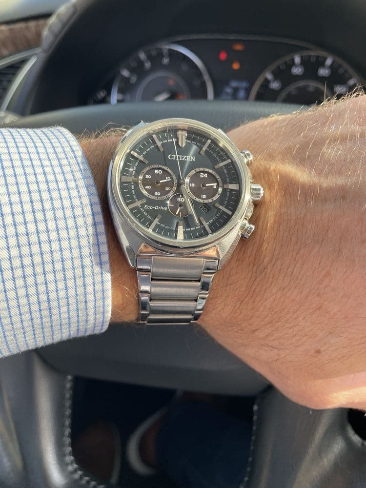 A person wearing a Citizen Eco-Drive watch