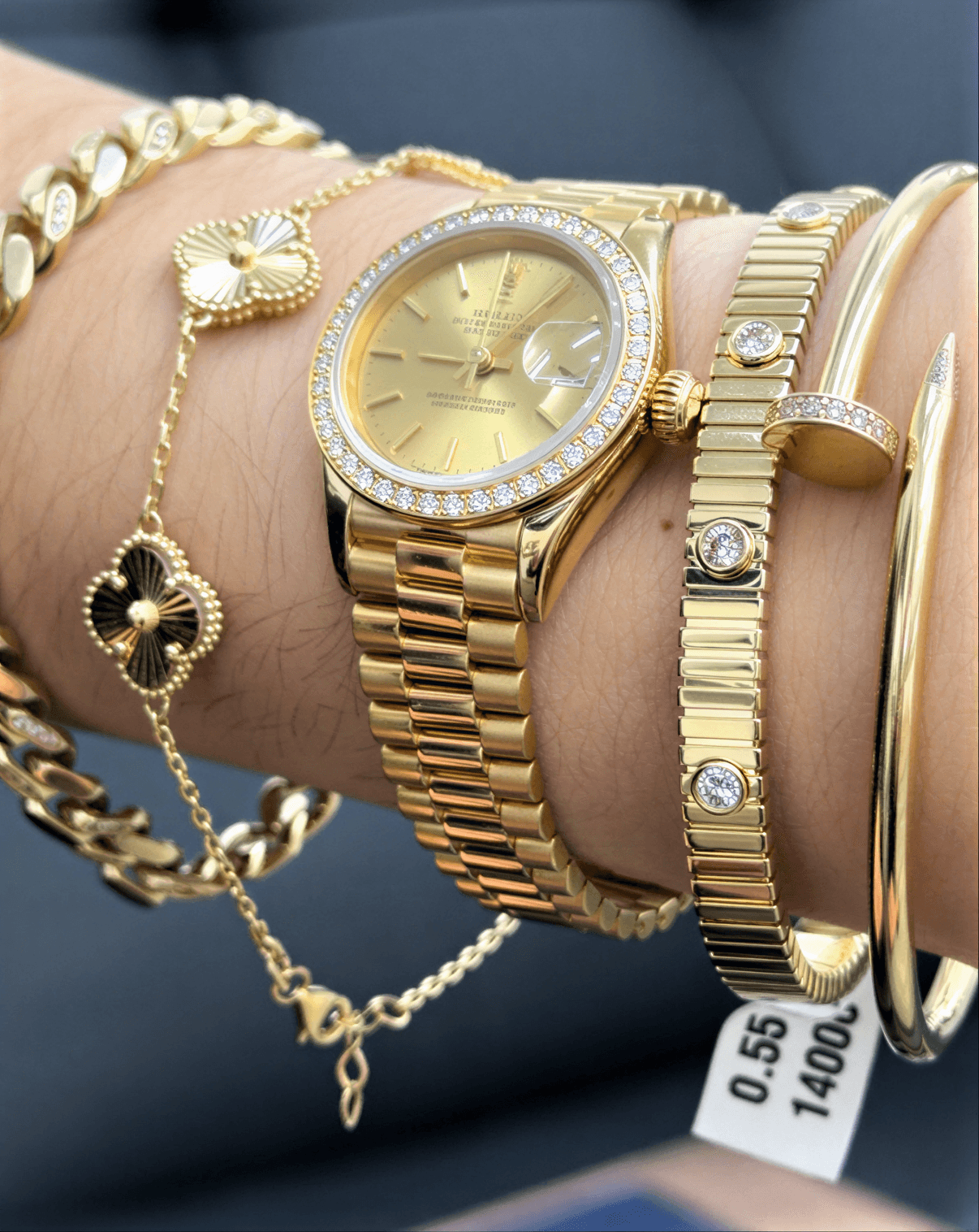 Premium gold watch with stacked jewelry