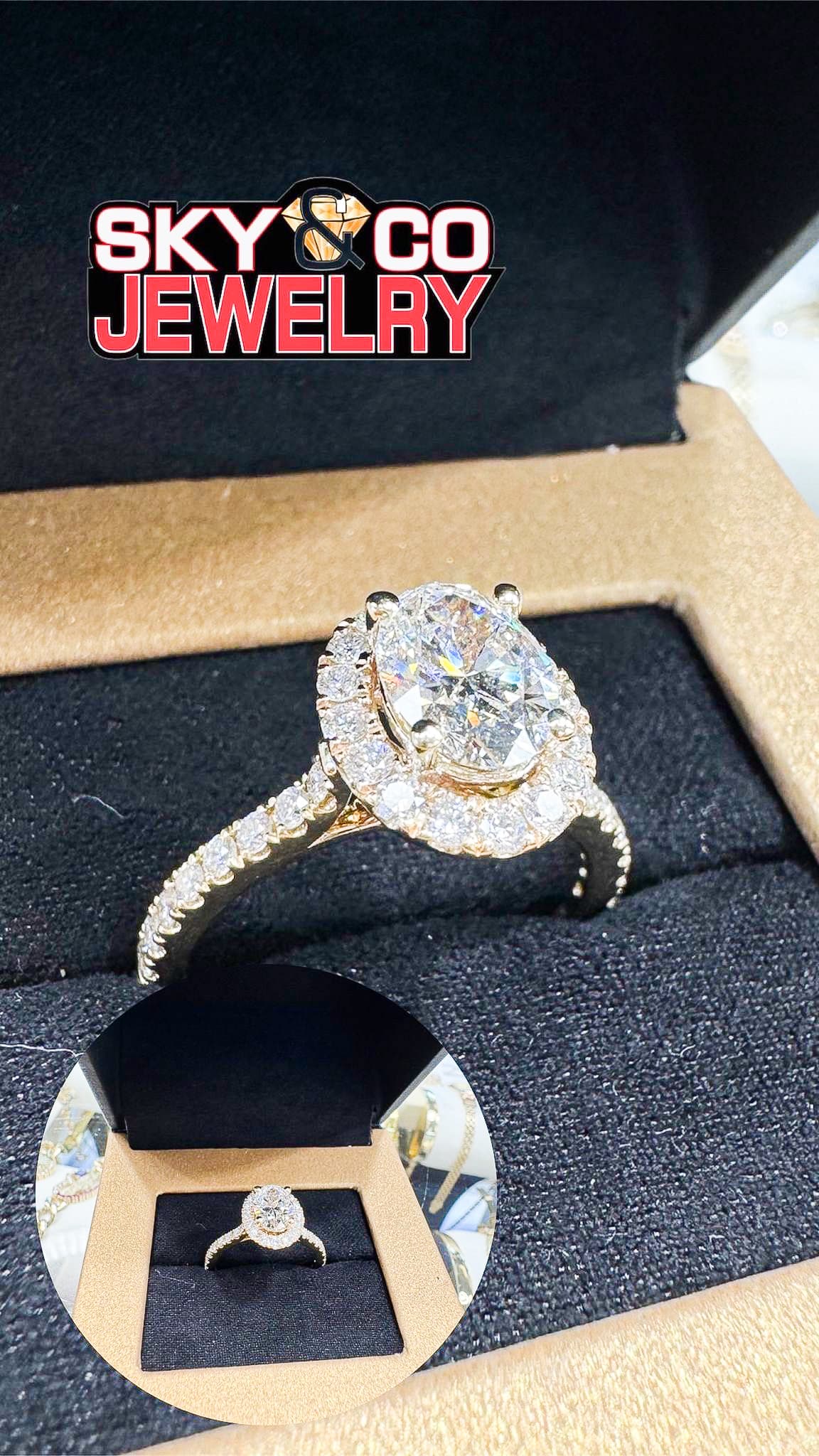 Magnificent oval diamond engagement ring with halo setting in Sky & Co presentation box