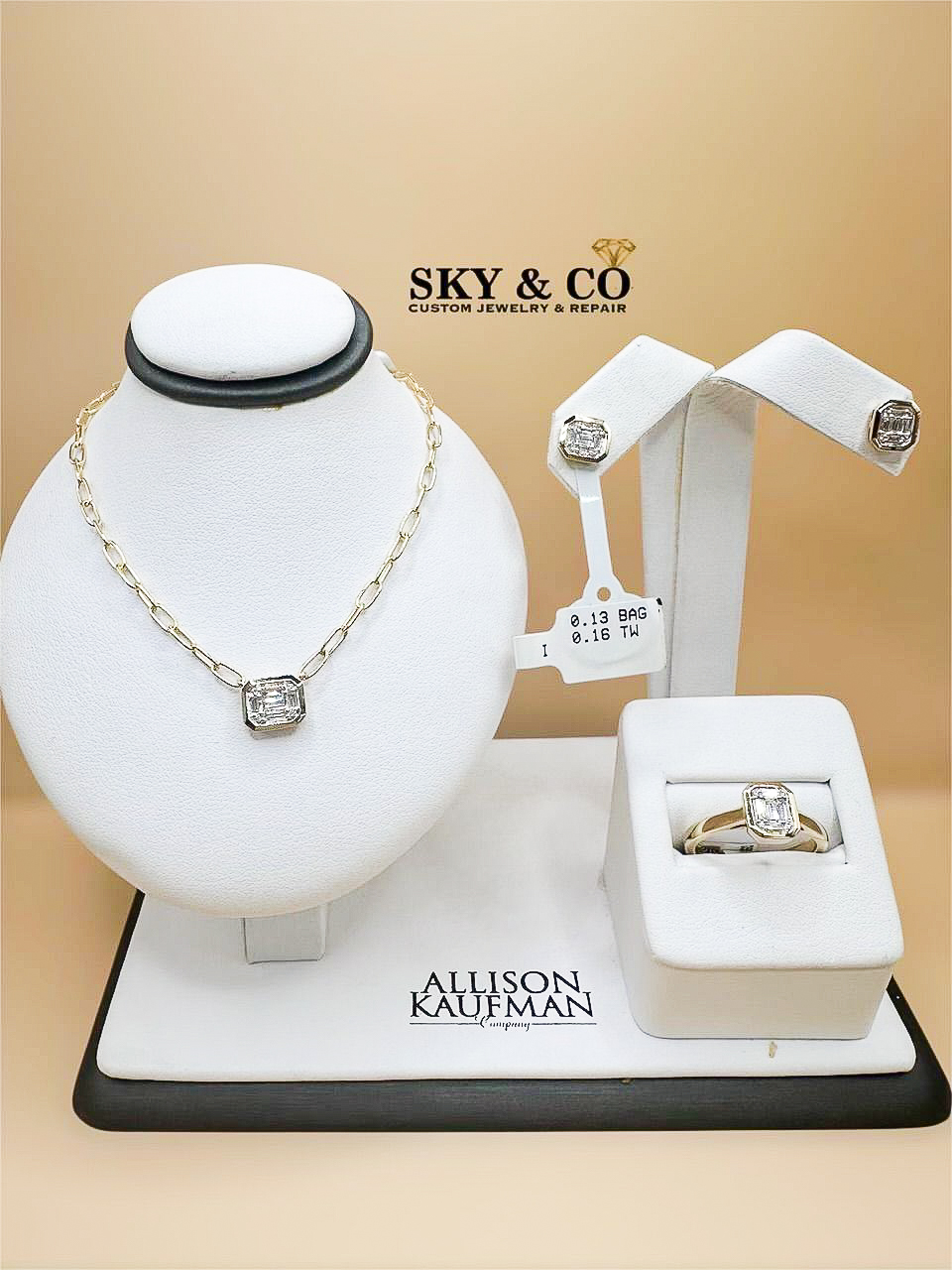Allison Kaufman necklace, earring, and ring set with emerald-cut diamonds